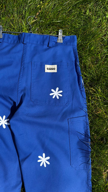 Pantalon unisexe bleu marguerites blanches
